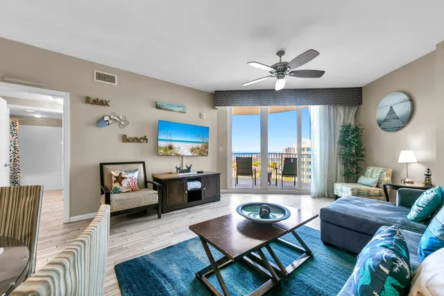 a living room with furniture and a large window