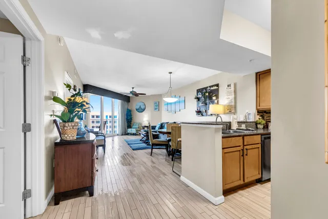 a kitchen view with appliances and wooden floor