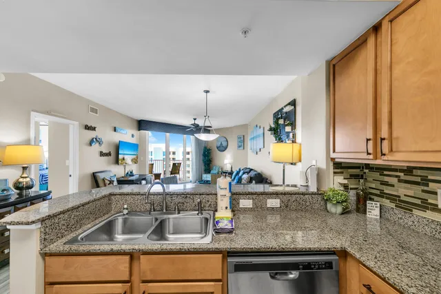 a kitchen with counter top space a sink and cabinets