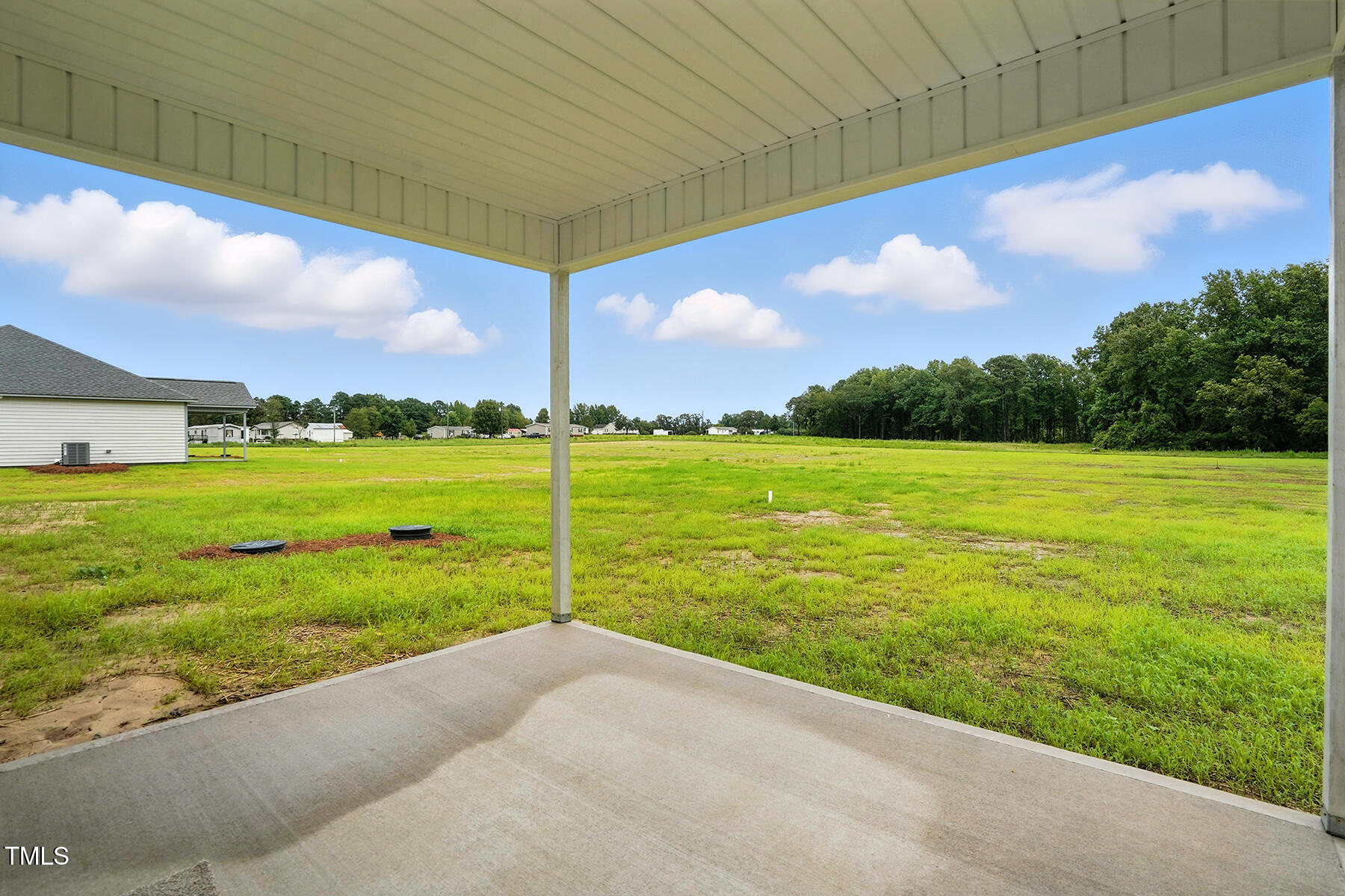 8686 Green Path Road Dunn, NC 28334 - Photo 26 of 31 a view of a field with a big yard