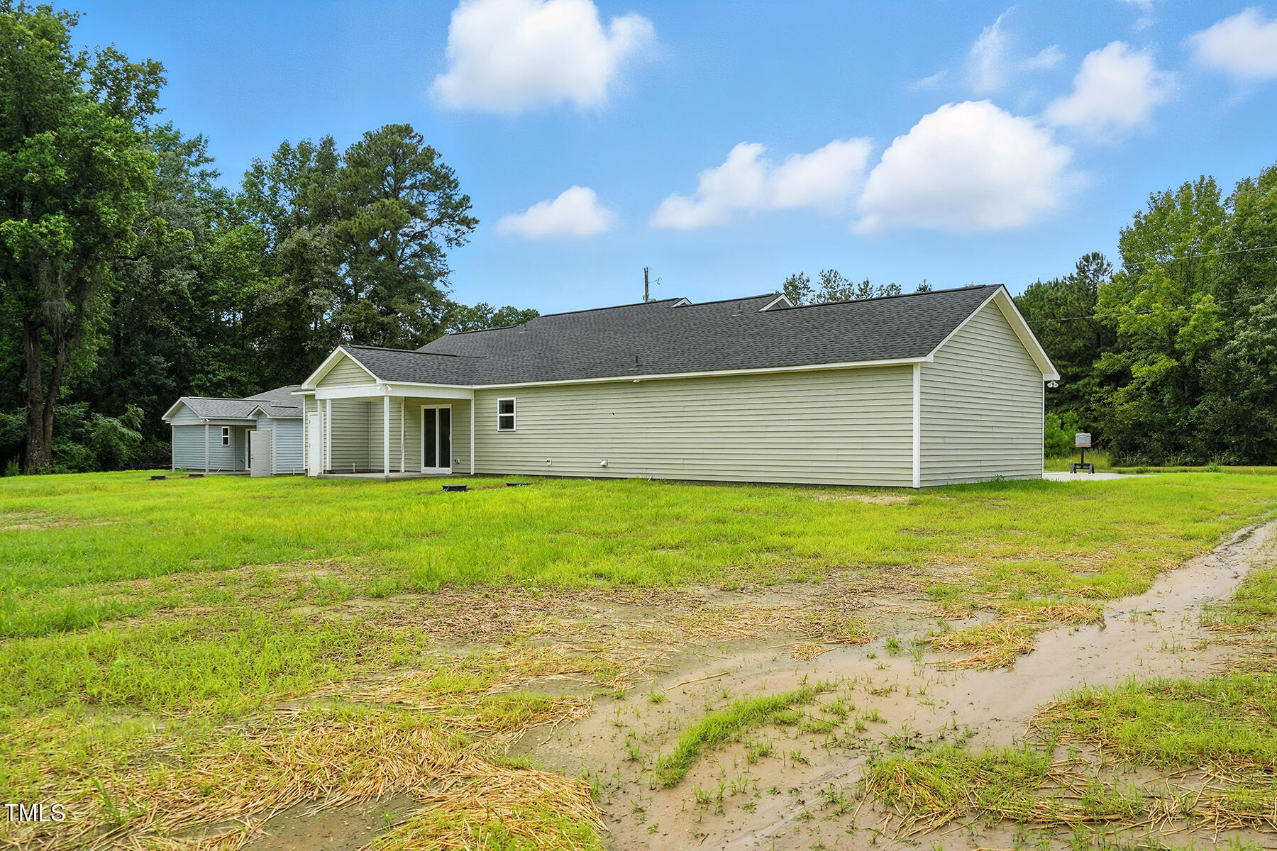 8686 Green Path Road Dunn, NC 28334 - Photo 29 of 31 a front view of house with yard and green space