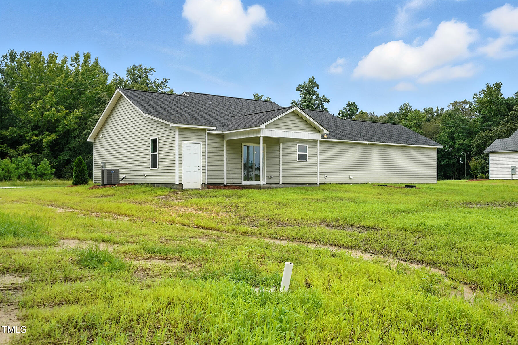 8686 Green Path Road Dunn, NC 28334 - Photo 30 of 31 a front view of house with yard and green space