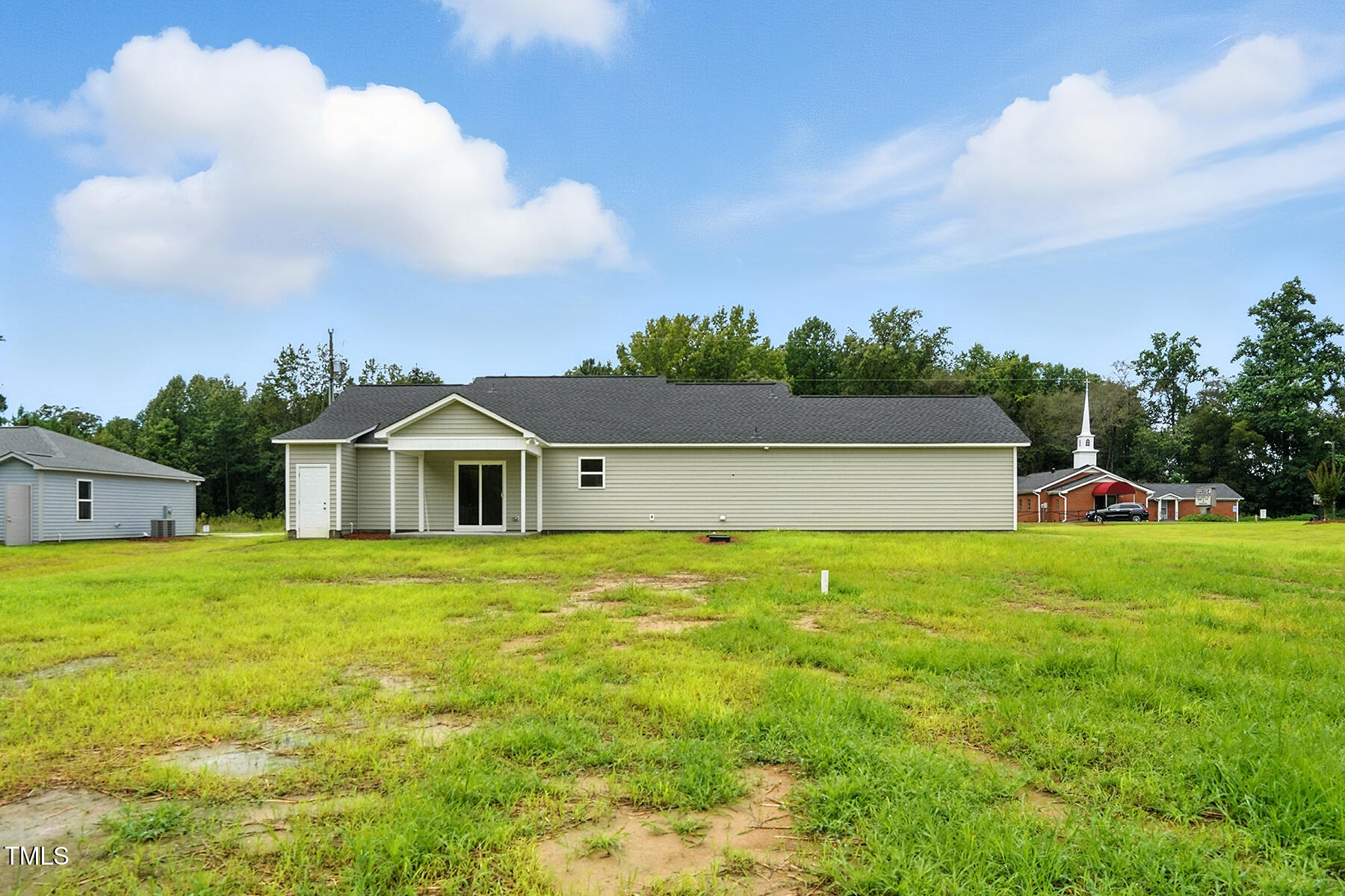 8686 Green Path Road Dunn, NC 28334 - Photo 31 of 31 a front view of a house with a yard