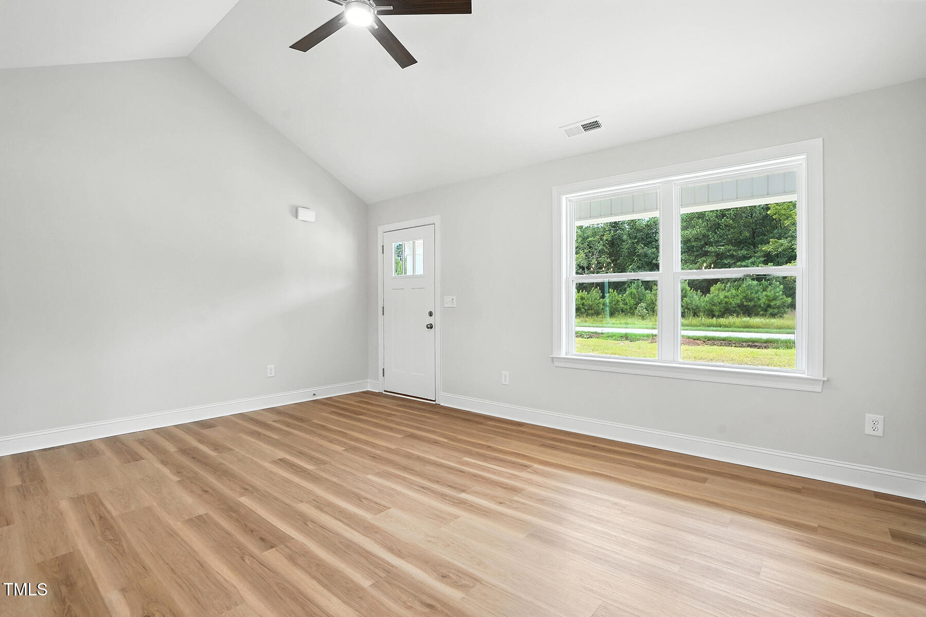8686 Green Path Road Dunn, NC 28334 - Photo 7 of 31 wooden floor in an empty room with a window
