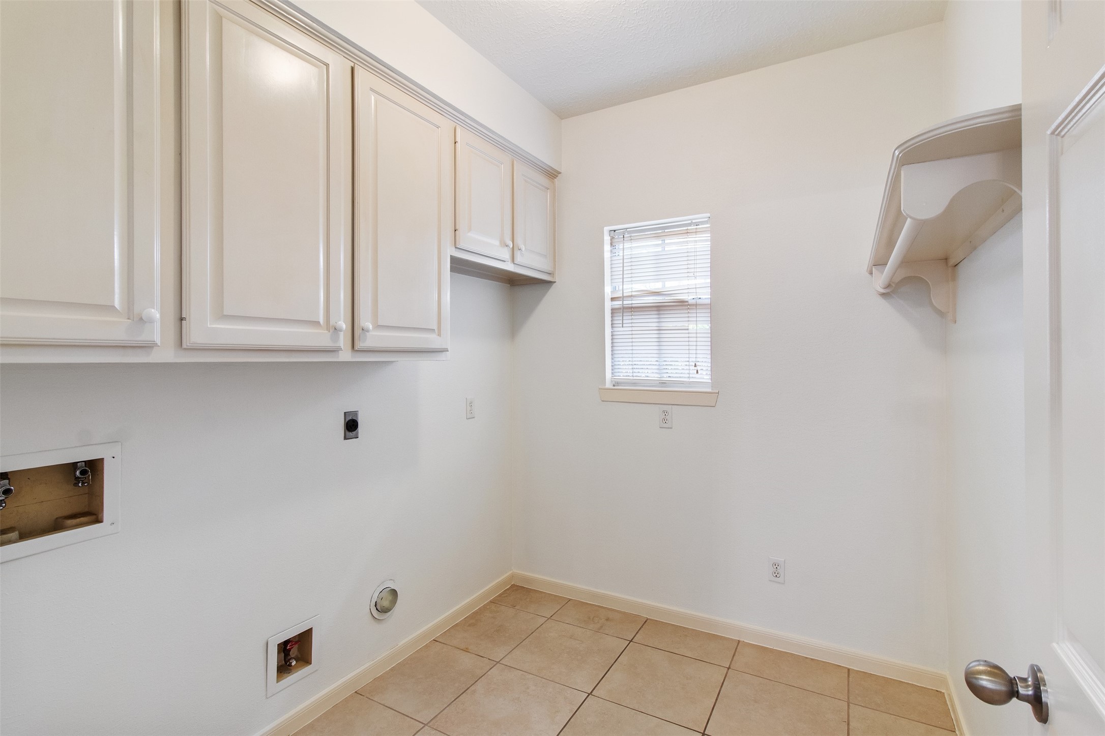 5127 Heathfield Court Houston, TX 77084 - Photo 13 of 37 This large laundry room has space for an additional refrigerator if needed.