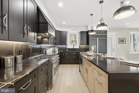 a kitchen with a sink and a window