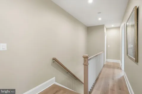 a bedroom with a bed and a night stand