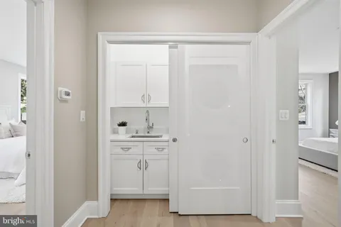 a spacious bedroom with a bed and a couch