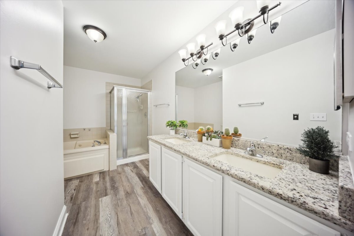 1148 Coldspring Road Elgin, IL 60120 - Photo 19 of 27 a spacious bathroom with a granite countertop sink a mirror and shower