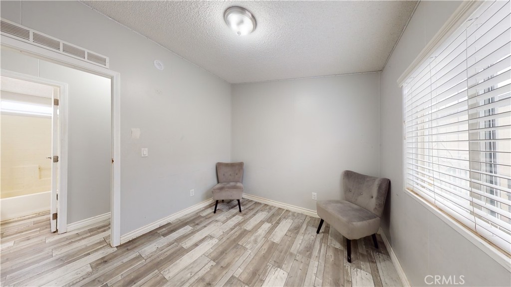 1782 Nisson Road, Unit 7 Tustin, CA 92780 - Photo 20 of 29 a spacious bedroom with a bed and a window