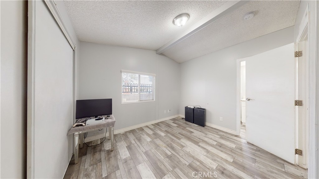 1782 Nisson Road, Unit 7 Tustin, CA 92780 - Photo 22 of 29 a bedroom with a bed and a flat screen tv