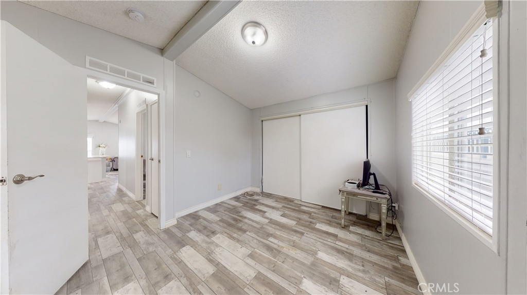 1782 Nisson Road, Unit 7 Tustin, CA 92780 - Photo 23 of 29 a view of empty room with wooden floor