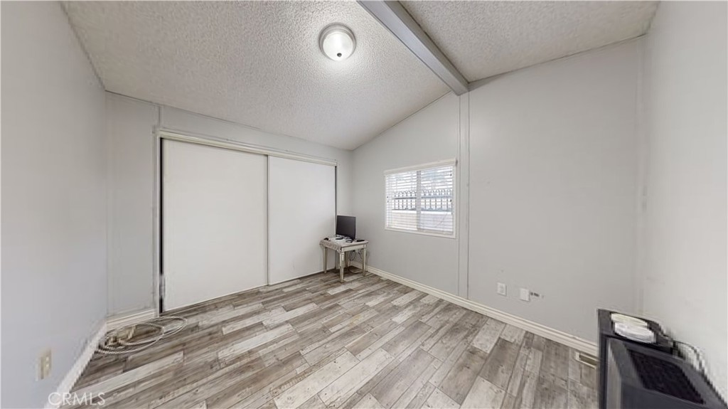 1782 Nisson Road, Unit 7 Tustin, CA 92780 - Photo 24 of 29 a view of empty room with wooden floor