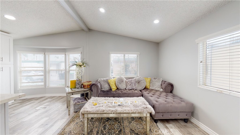 1782 Nisson Road, Unit 7 Tustin, CA 92780 - Photo 4 of 29 a living room with furniture and a window