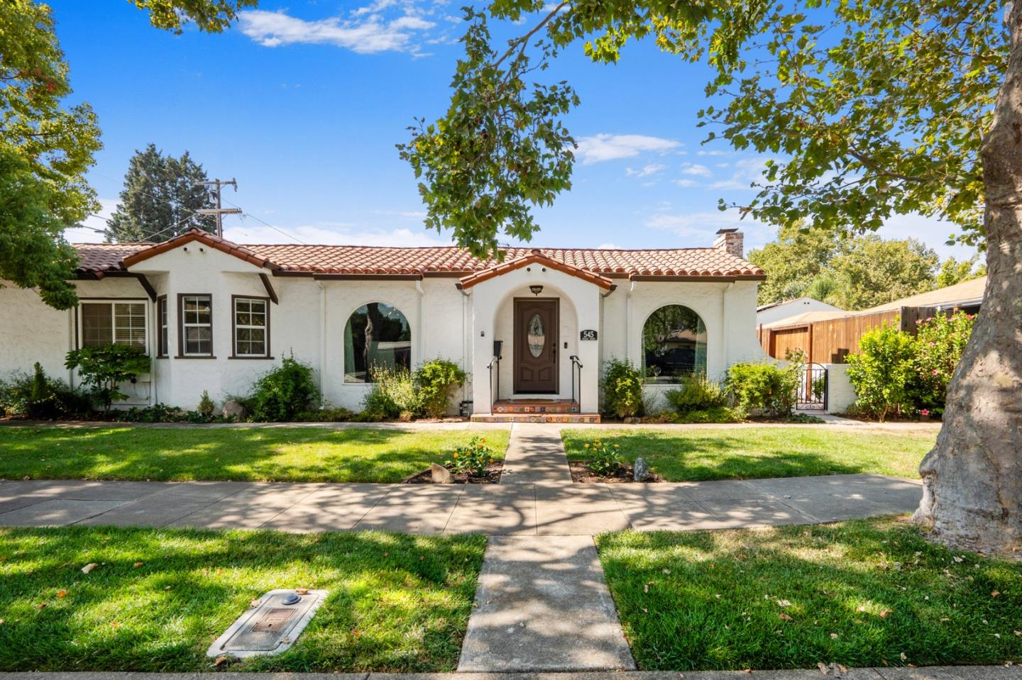 545 4th Street Gilroy, CA 95020 - Photo 1 of 36 a front view of a house with a garden