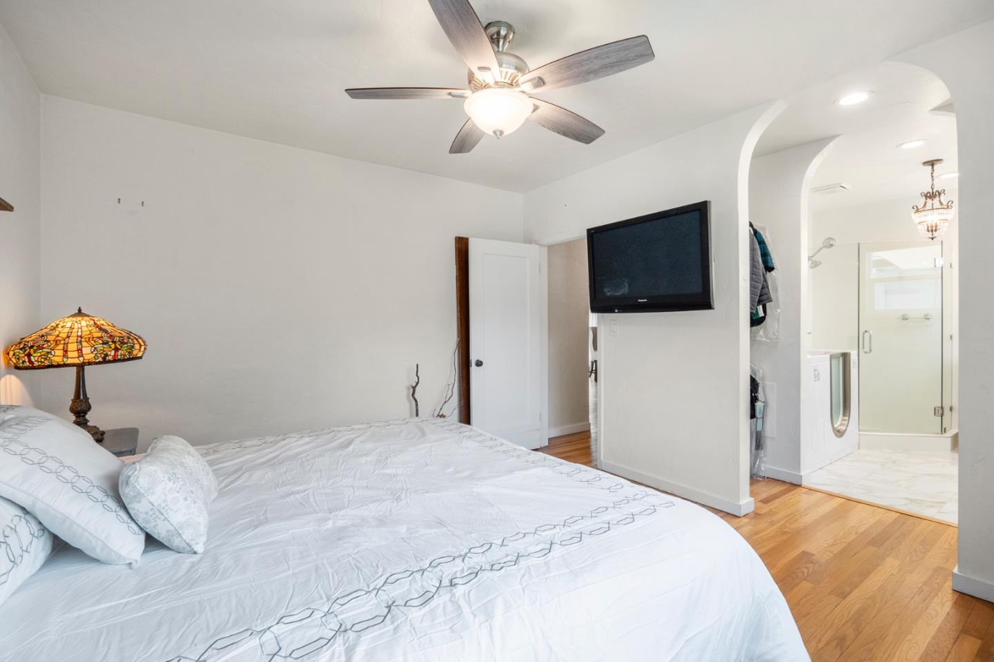545 4th Street Gilroy, CA 95020 - Photo 17 of 36 a bedroom with a bed and a flat screen tv