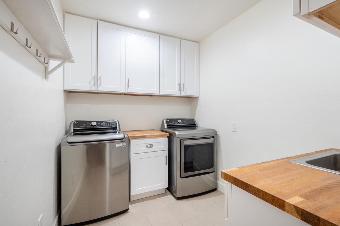 545 4th Street Gilroy, CA 95020 - Photo 25 of 36 a kitchen with stainless steel appliances granite countertop a stove a sink and a refrigerator