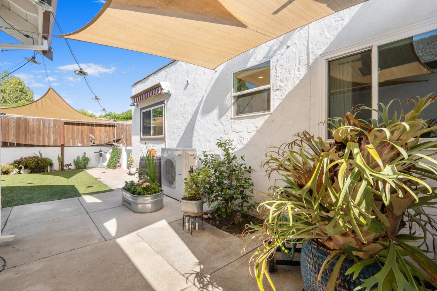 545 4th Street Gilroy, CA 95020 - Photo 30 of 36 a view of a patio with table and chairs and potted plants