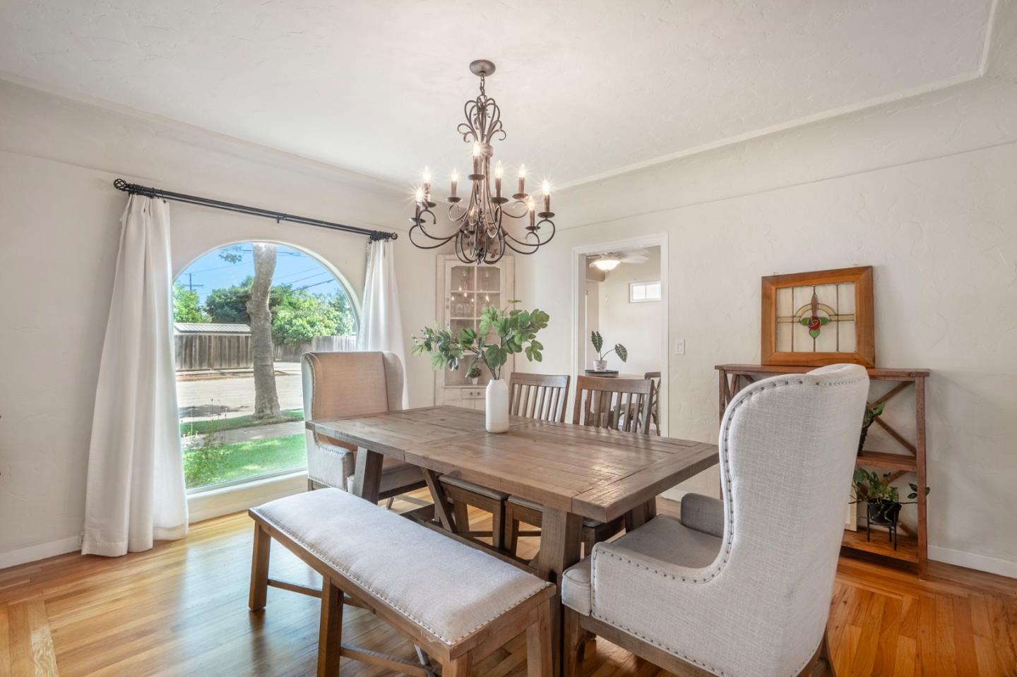 545 4th Street Gilroy, CA 95020 - Photo 7 of 36 a view of a dining room with furniture window and wooden floor