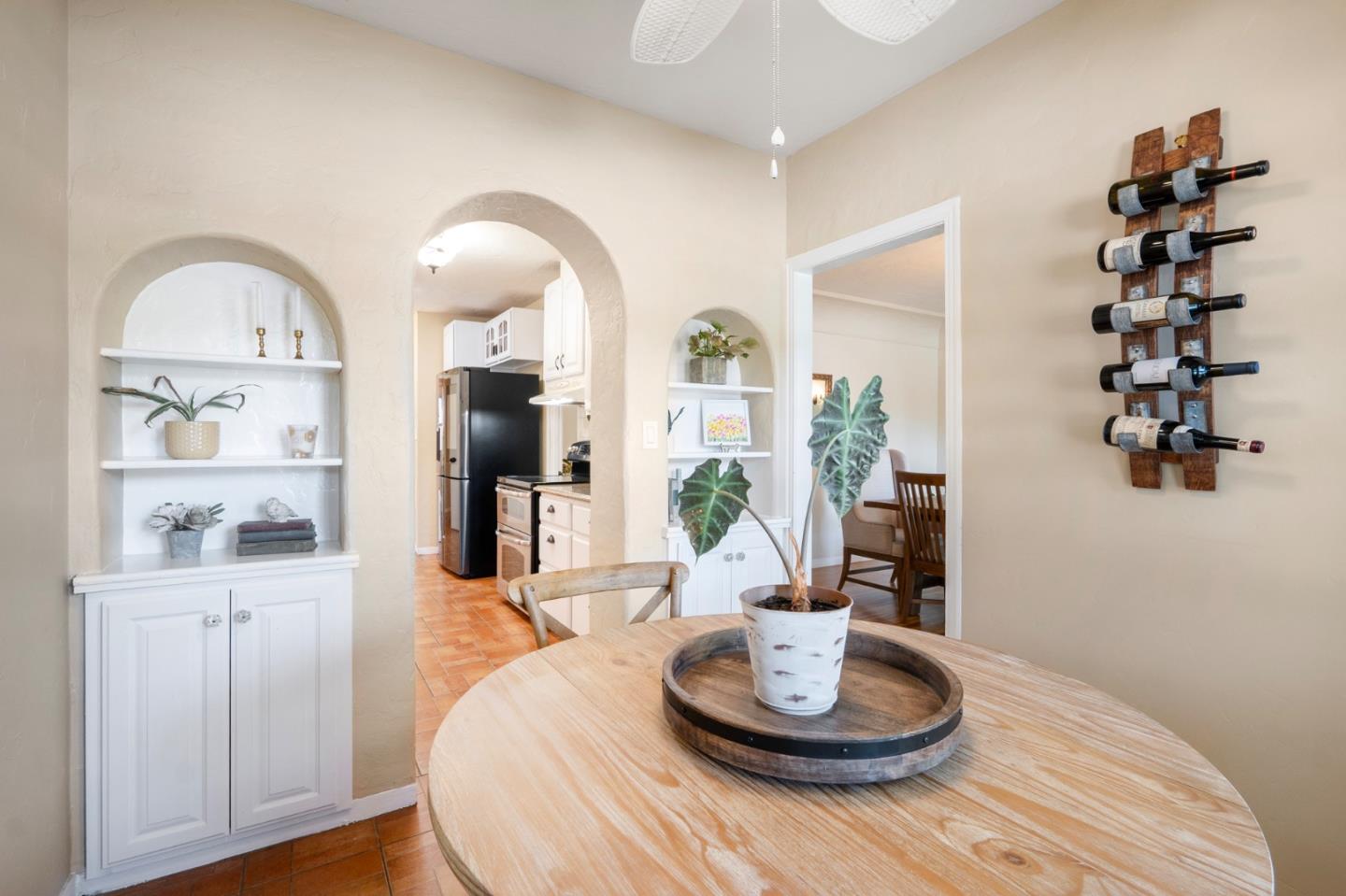 545 4th Street Gilroy, CA 95020 - Photo 10 of 36 a living room with hard wood floor and a dining table with wooden floor