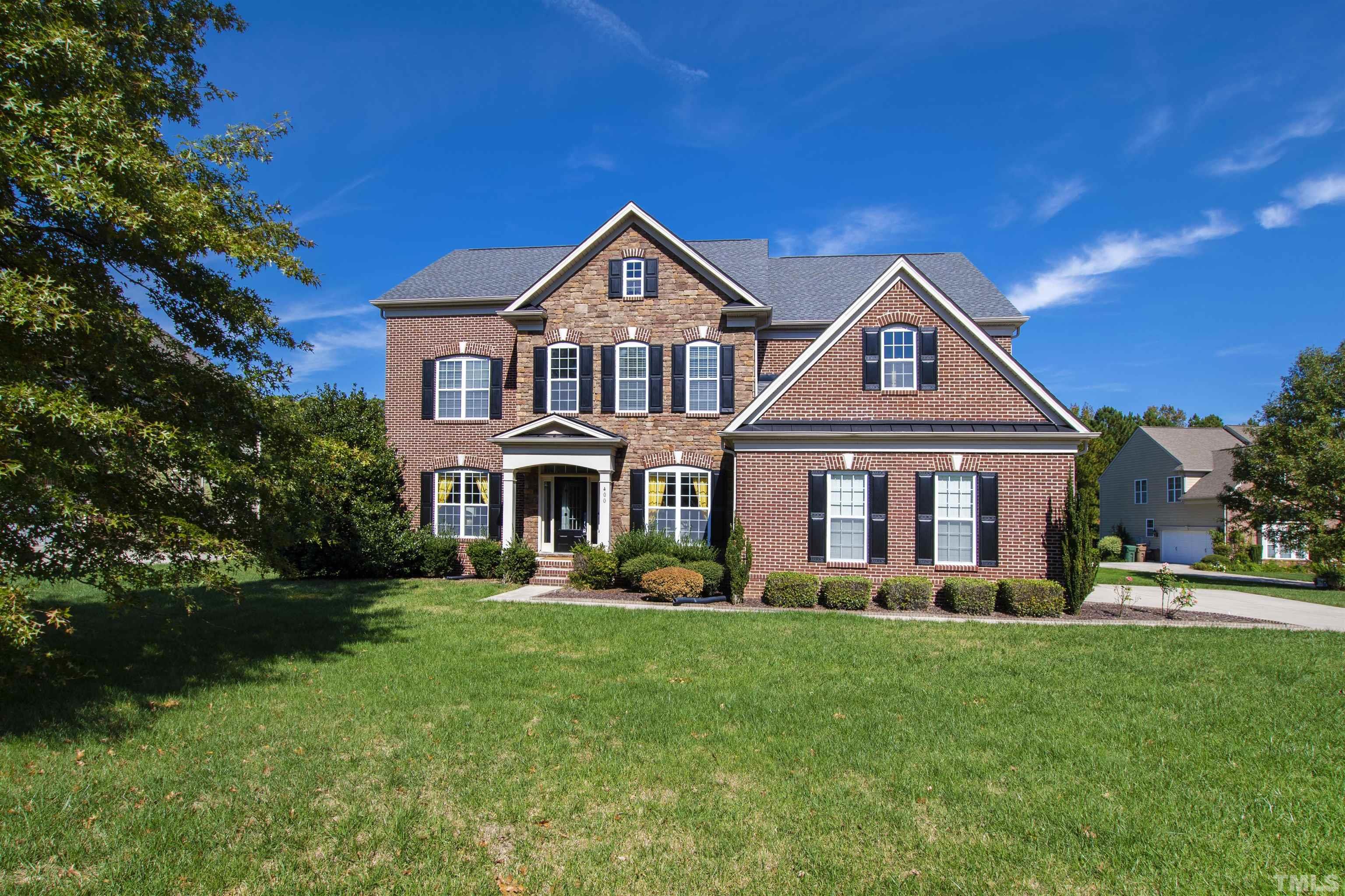 400 Alliance Circle Cary, NC 27519 - Photo 1 of 62 a front view of a house with a yard