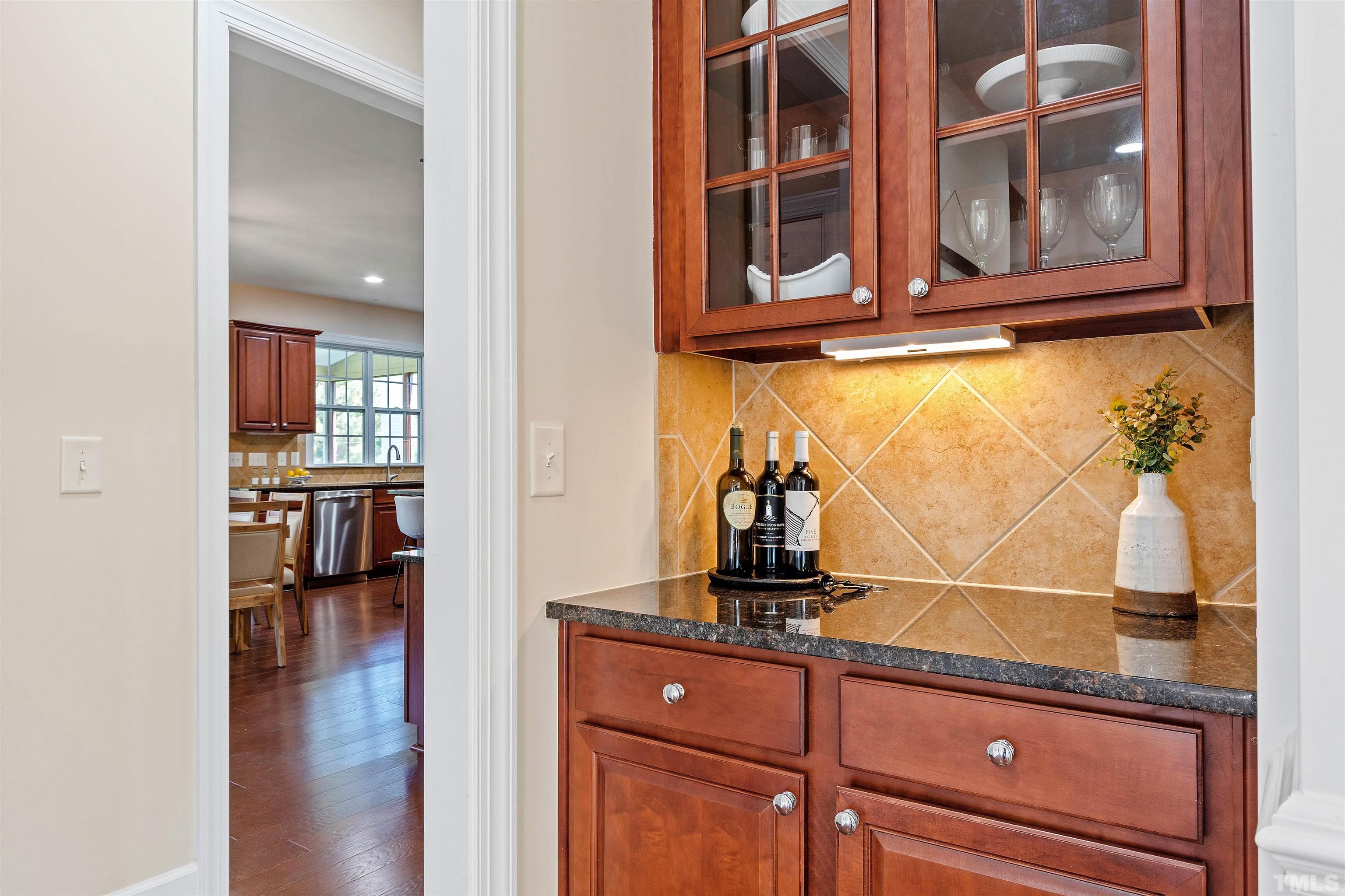 400 Alliance Circle Cary, NC 27519 - Photo 25 of 62 a kitchen with stainless steel appliances granite countertop a stove and cabinets