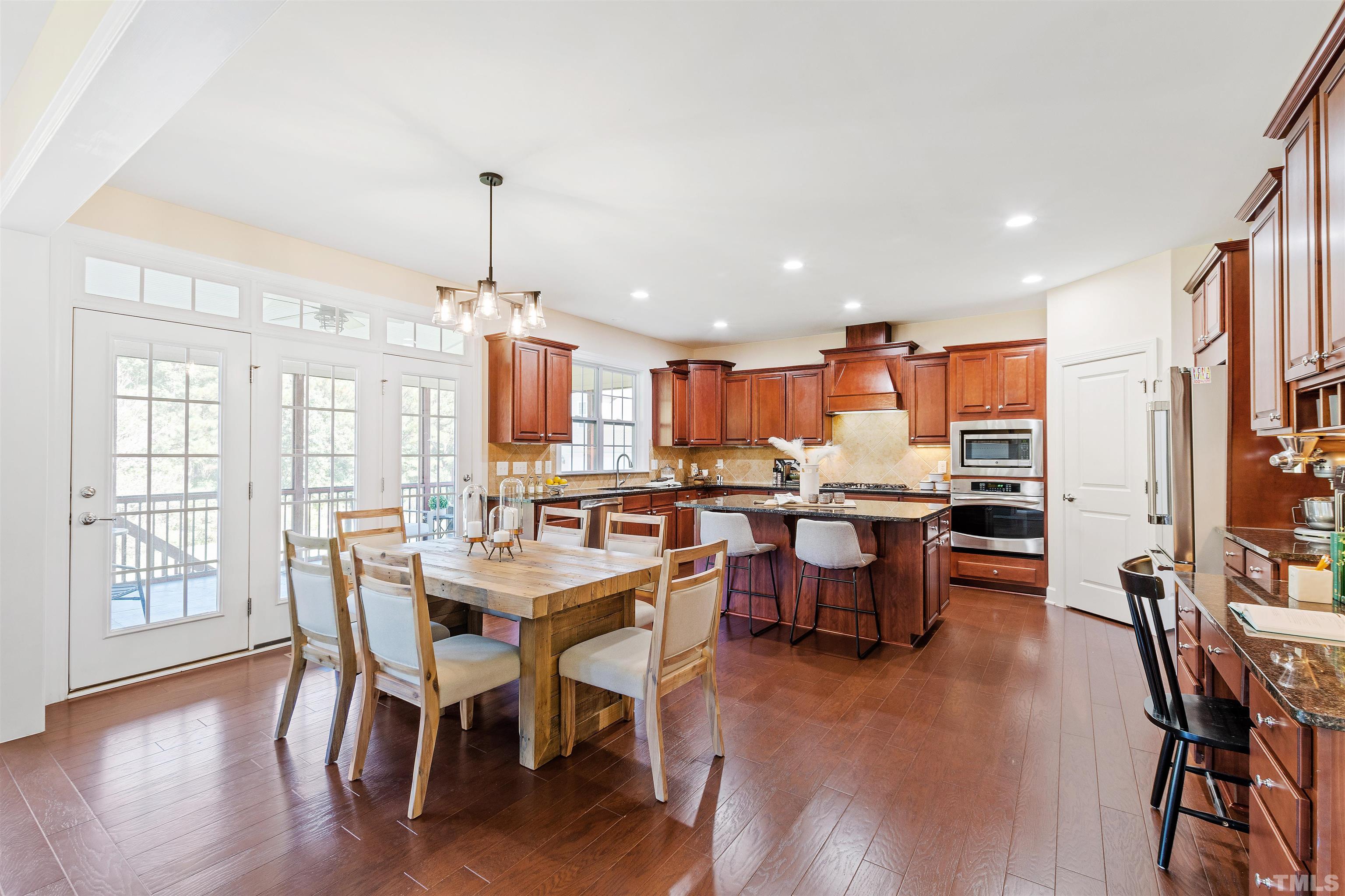 400 Alliance Circle Cary, NC 27519 - Photo 2 of 62 a dining room with furniture window and wooden floor