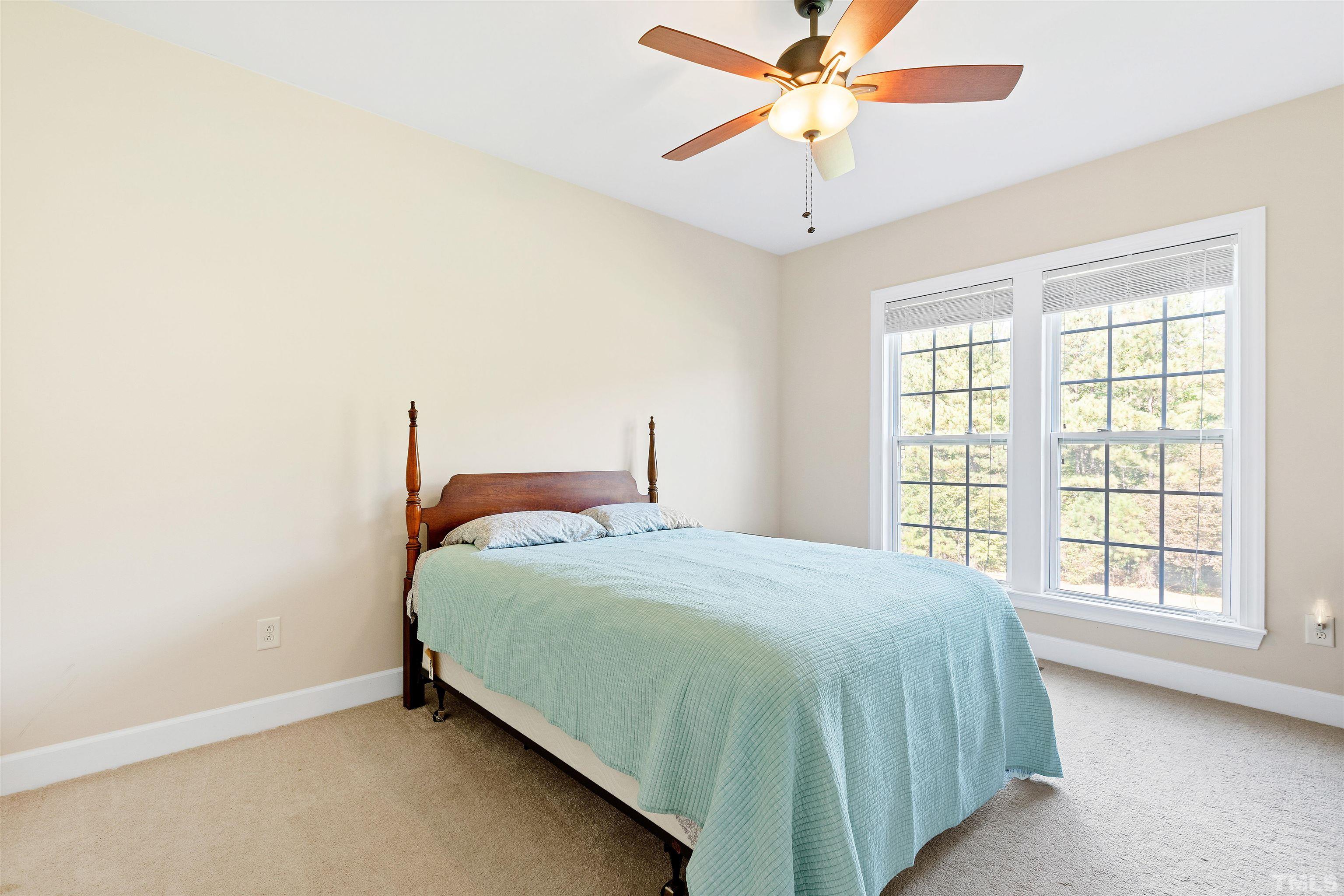 400 Alliance Circle Cary, NC 27519 - Photo 39 of 62 a bedroom with a bed and window