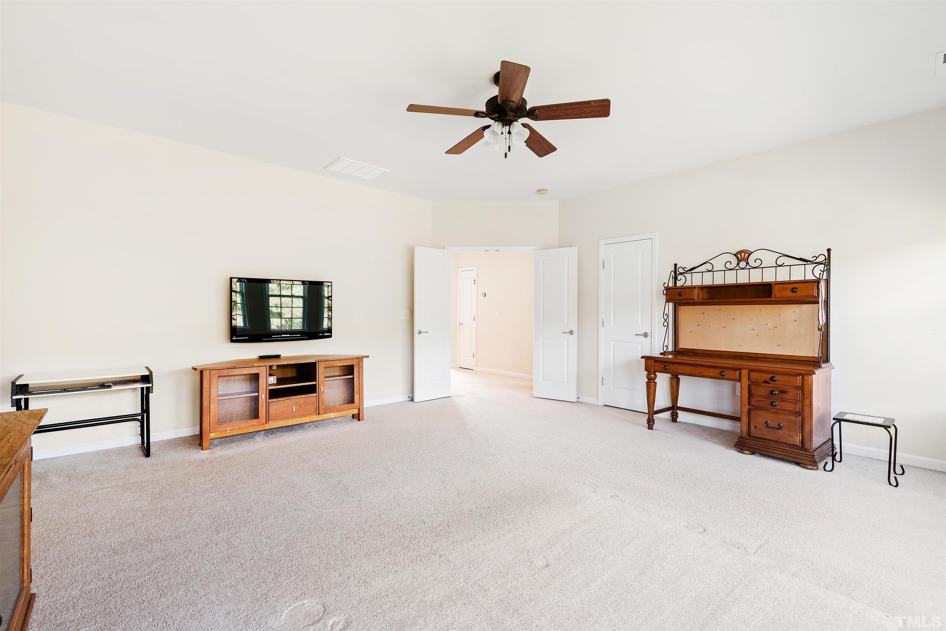 400 Alliance Circle Cary, NC 27519 - Photo 41 of 62 a view of a livingroom with furniture and a flat screen tv