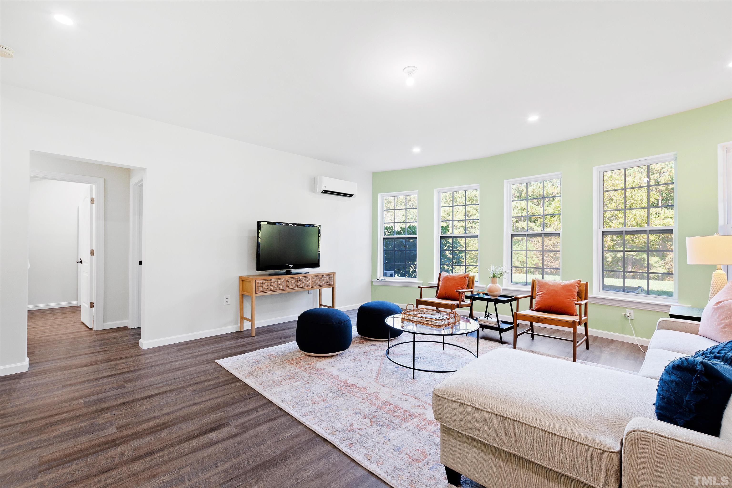 400 Alliance Circle Cary, NC 27519 - Photo 46 of 62 a living room with furniture and a flat screen tv