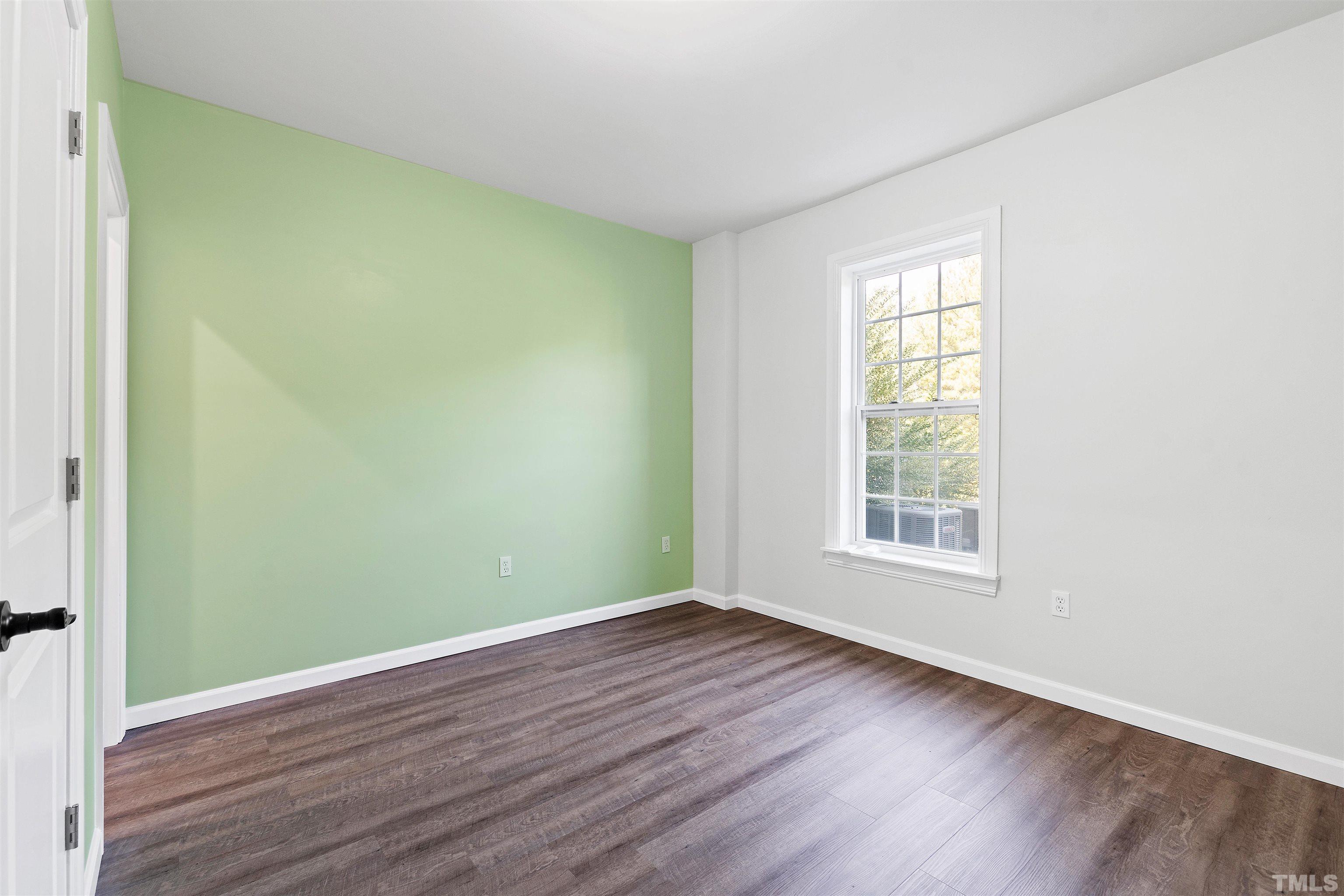 400 Alliance Circle Cary, NC 27519 - Photo 49 of 62 an empty room with wooden floor and windows