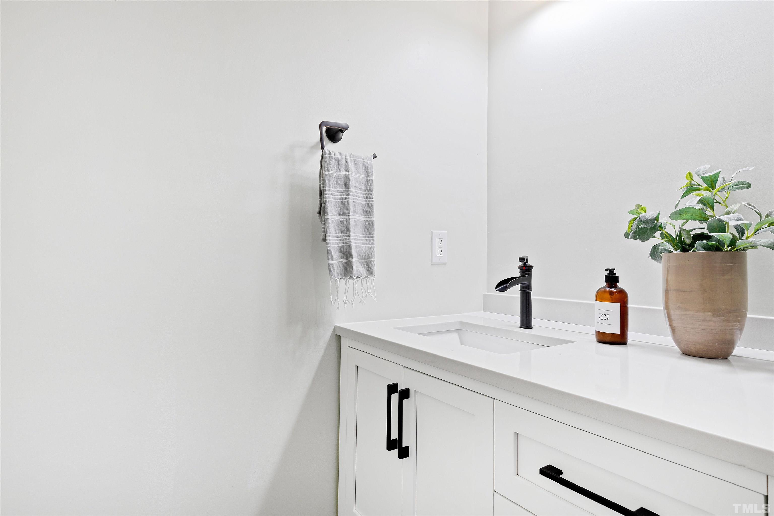 400 Alliance Circle Cary, NC 27519 - Photo 51 of 62 a bathroom with a sink and a mirror