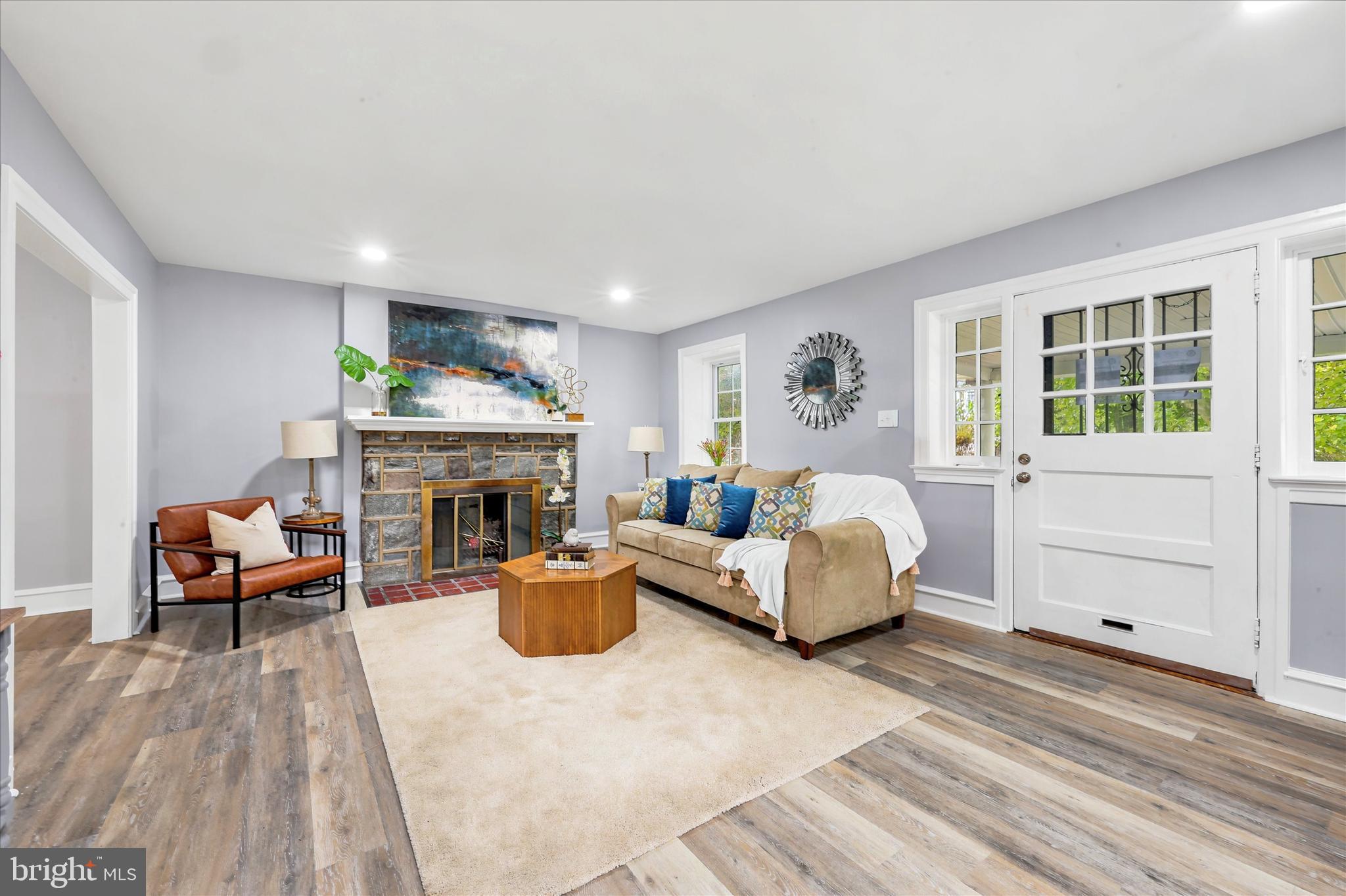 7208 Hilltop Road Upper Darby, PA 19082 - Photo 6 of 28 a bed room with furniture and a fireplace