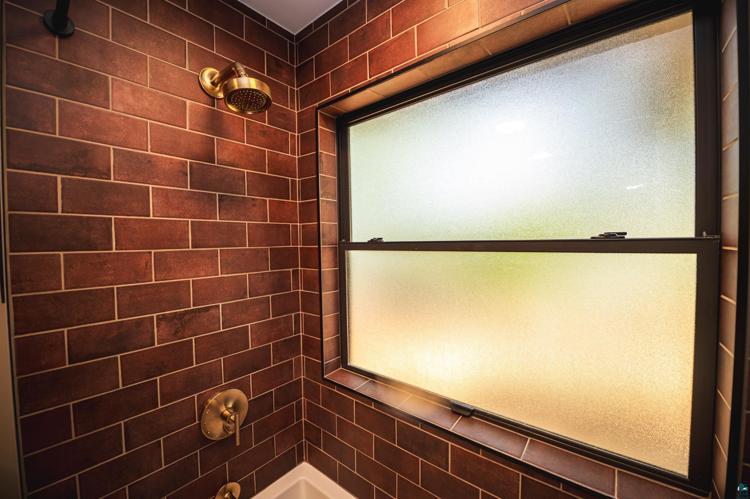 14635 Canadian Border Road Ely, MN 55731 - Photo 23 of 94 Subway tile shower surround with bronze fixtures