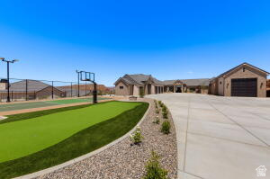 1141 East Lost Ridge Drive Washington, UT 84780 - Photo 23 of 108 Expansive concrete driveway leading to a multi-car garage and a single-story residence
