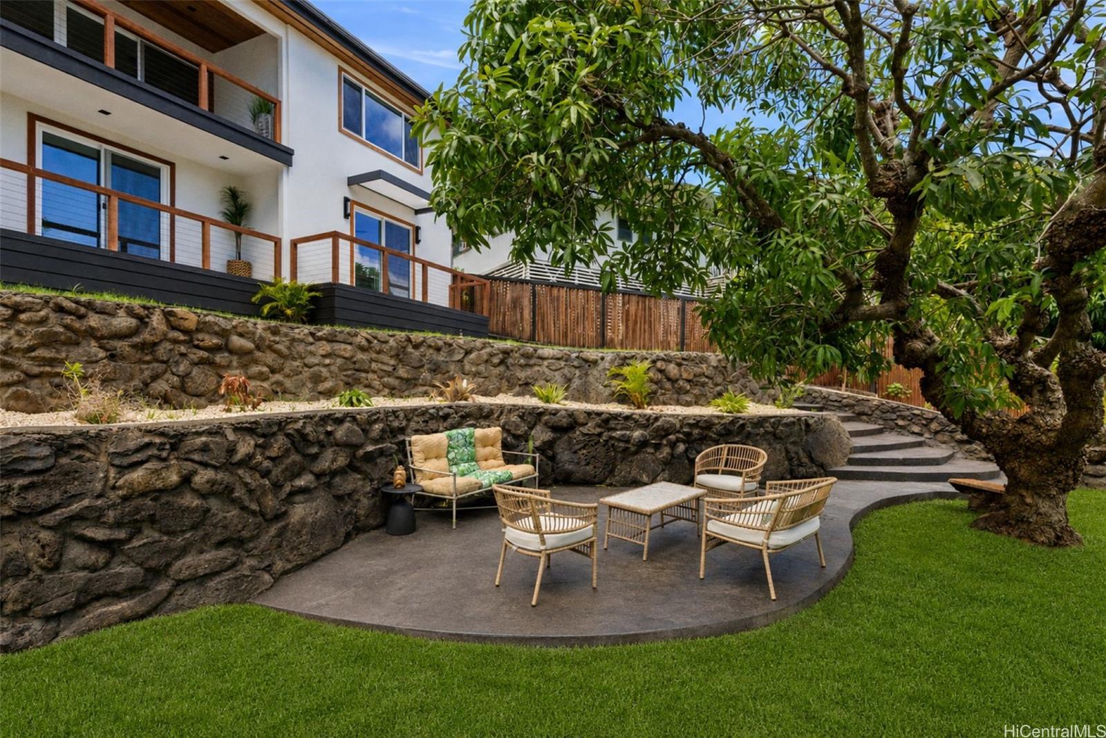 852 Kainoa Place Honolulu, HI 96821 - Photo 19 of 25 a view of a patio with table and chairs and potted plants