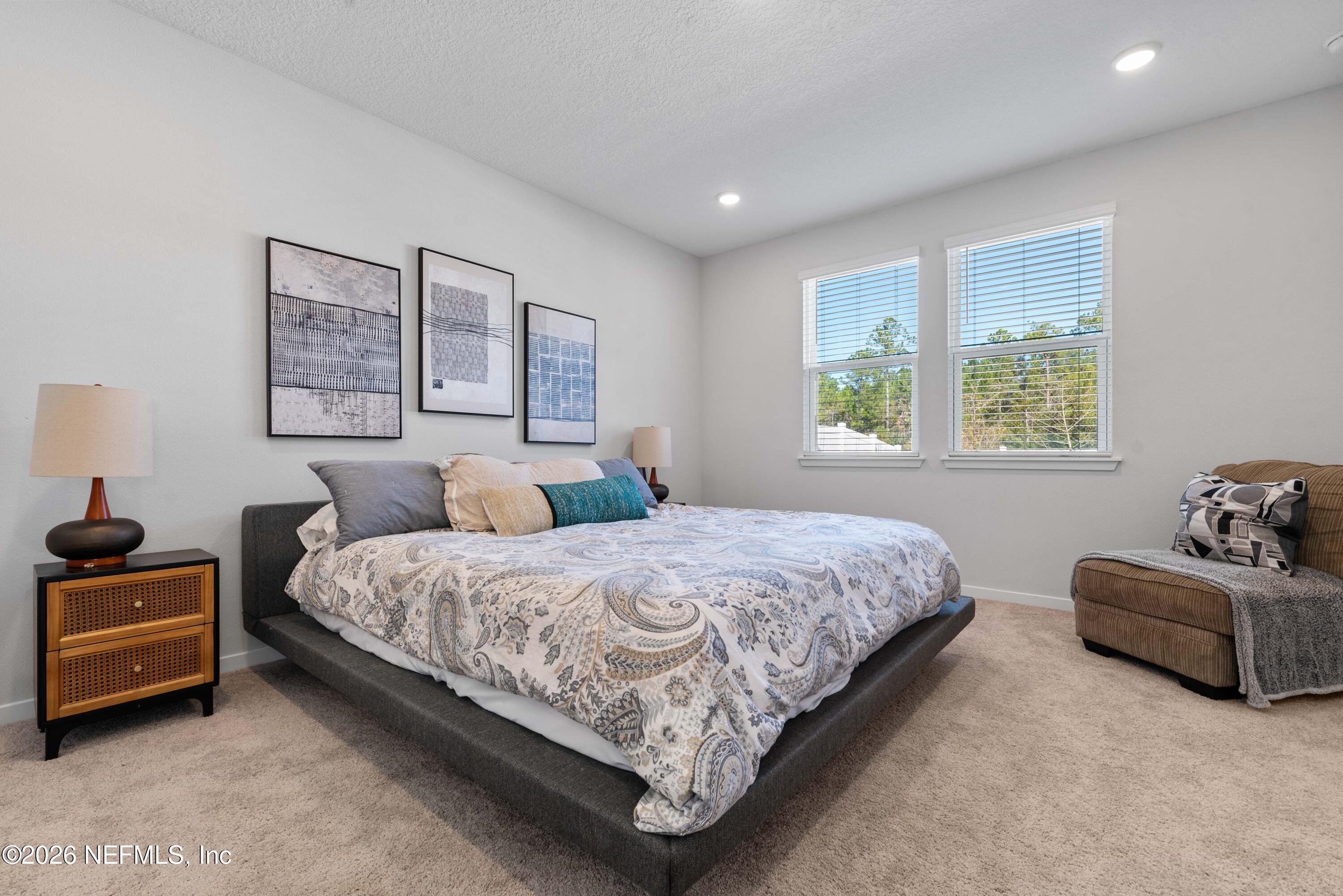 96245 Broadmoore Road Fernandina Beach, FL 32034 - Photo 15 of 33 a bedroom with bed and window