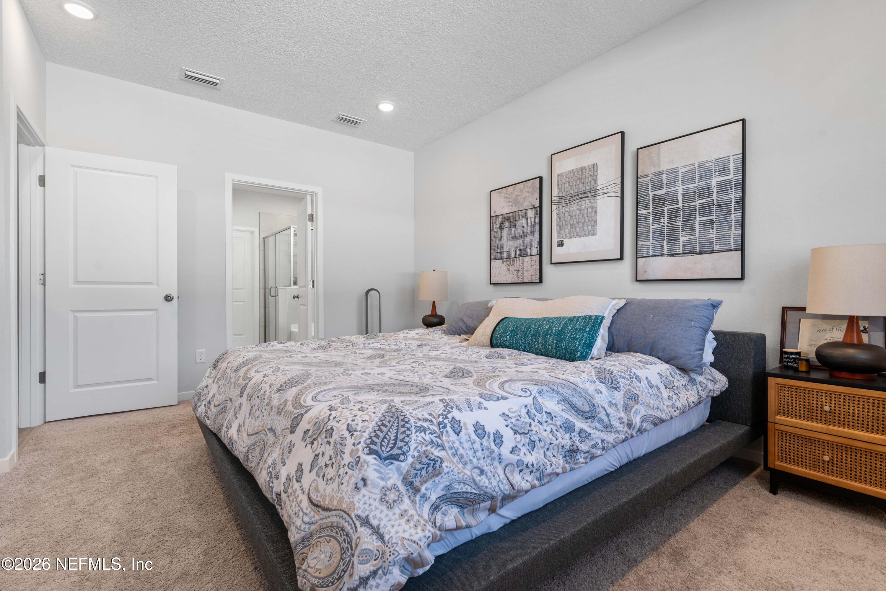 96245 Broadmoore Road Fernandina Beach, FL 32034 - Photo 16 of 33 a bedroom with a bed and closet with window