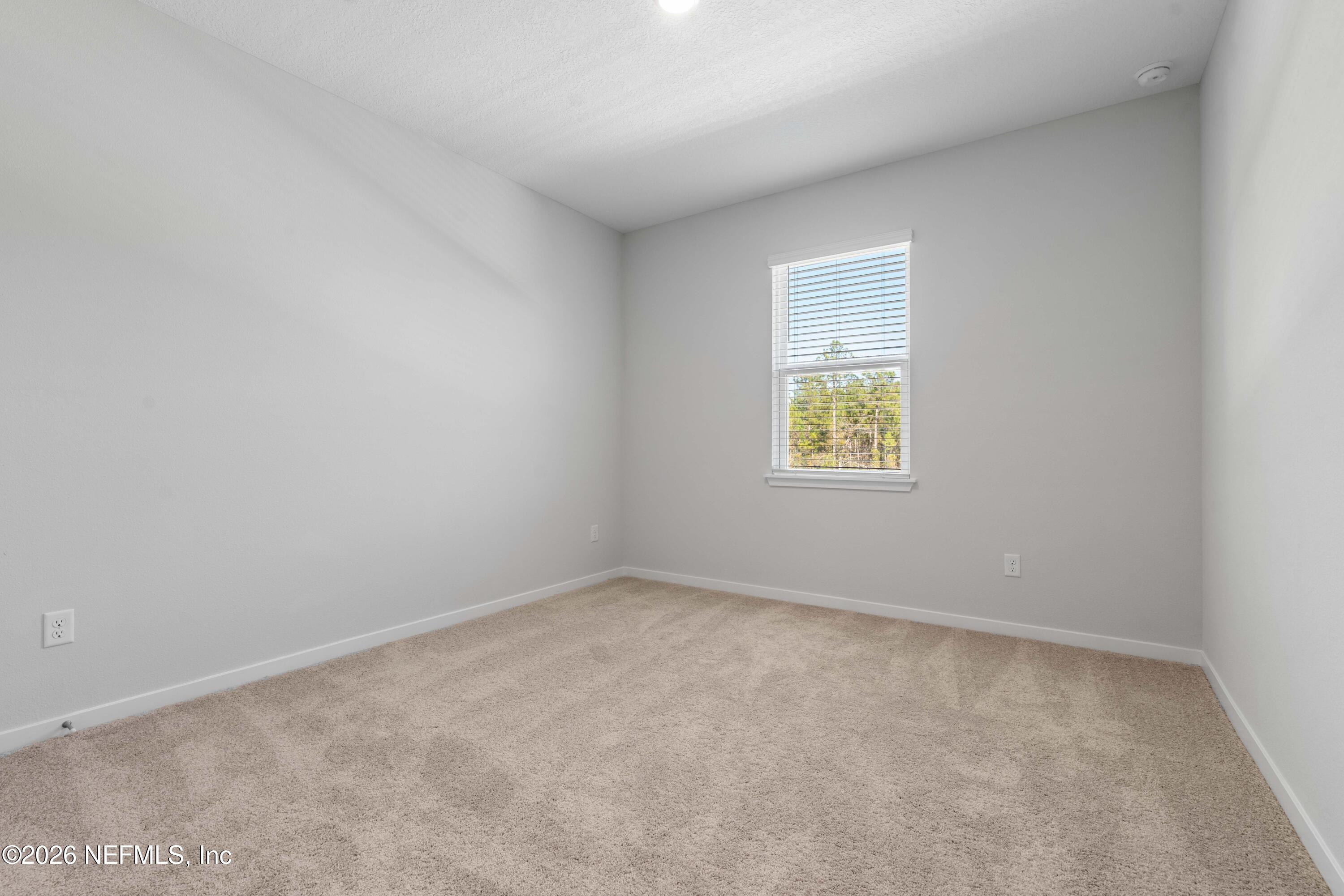 96245 Broadmoore Road Fernandina Beach, FL 32034 - Photo 26 of 33 an empty room with a window