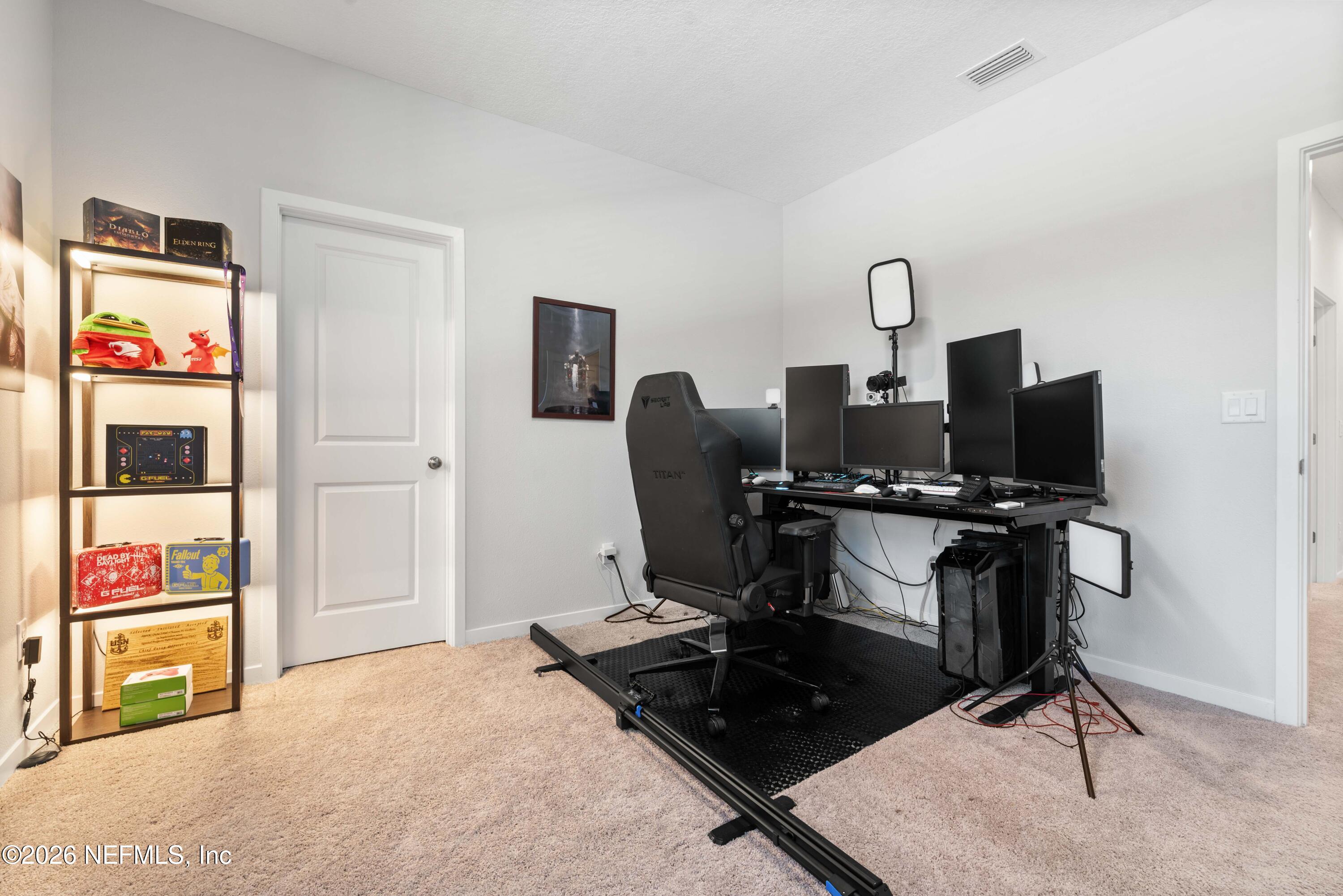 96245 Broadmoore Road Fernandina Beach, FL 32034 - Photo 27 of 33 a view of a workspace with furniture and a window