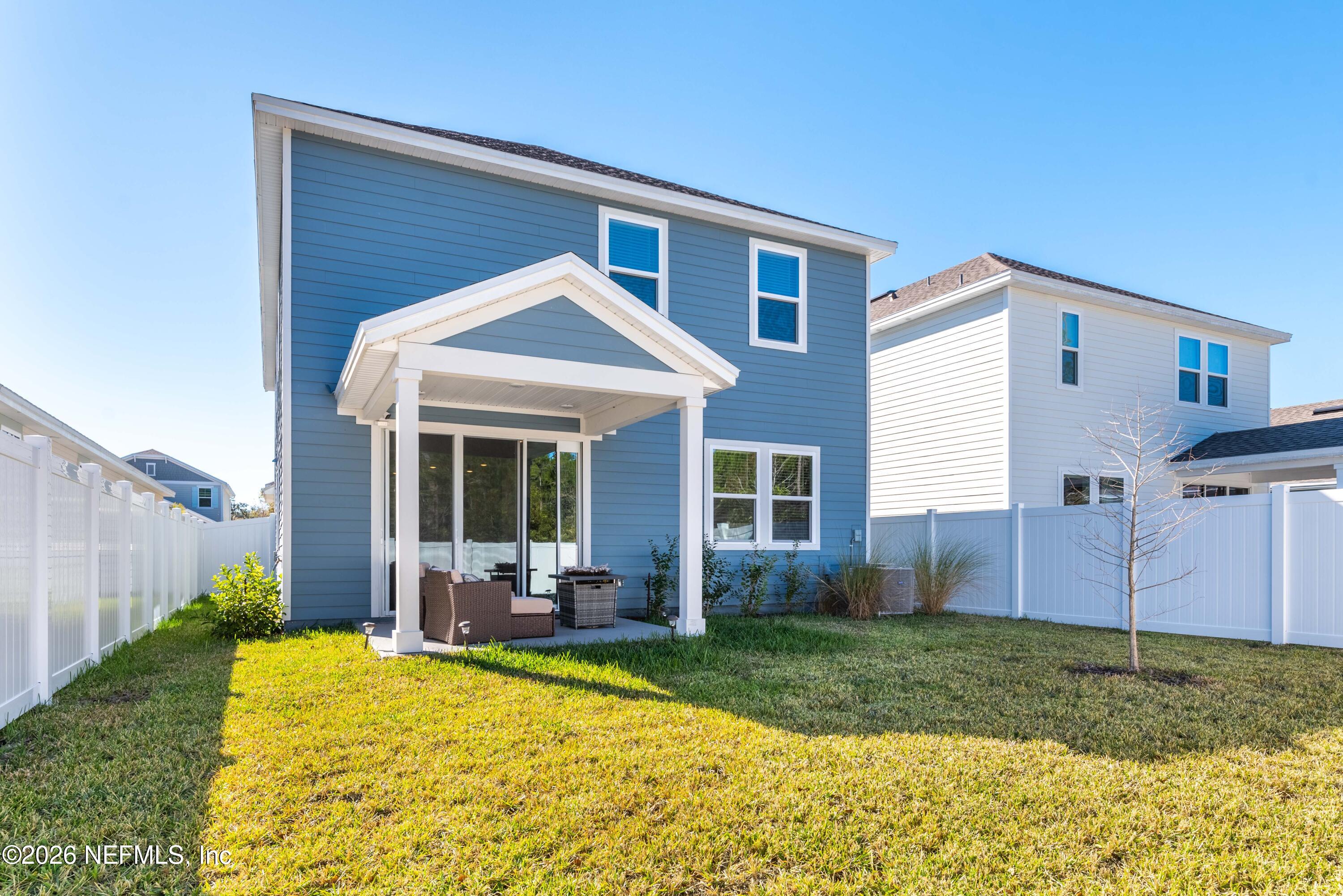 96245 Broadmoore Road Fernandina Beach, FL 32034 - Photo 31 of 33 a view of a house with backyard and porch