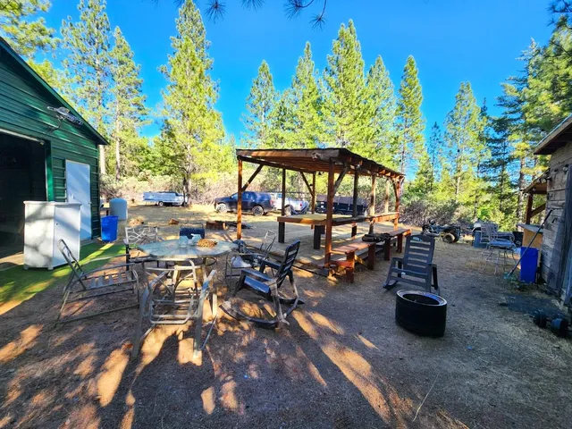 a bedroom with a bed and a flat tv screen on a dresser