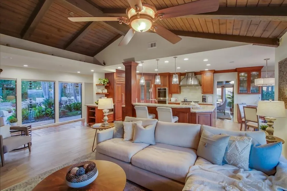 16062 Stoney Acres Road Poway, CA 92064 - Photo 39 of 75 a living room with furniture a ceiling fan and a kitchen