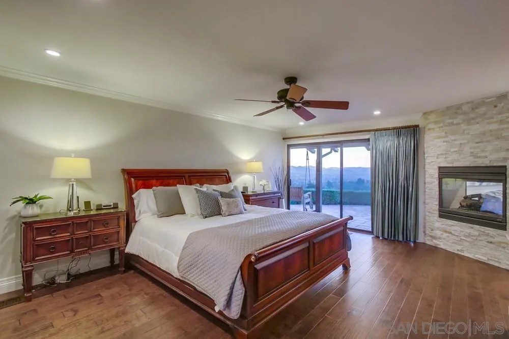 16062 Stoney Acres Road Poway, CA 92064 - Photo 40 of 75 a bed room with a bed and a tv