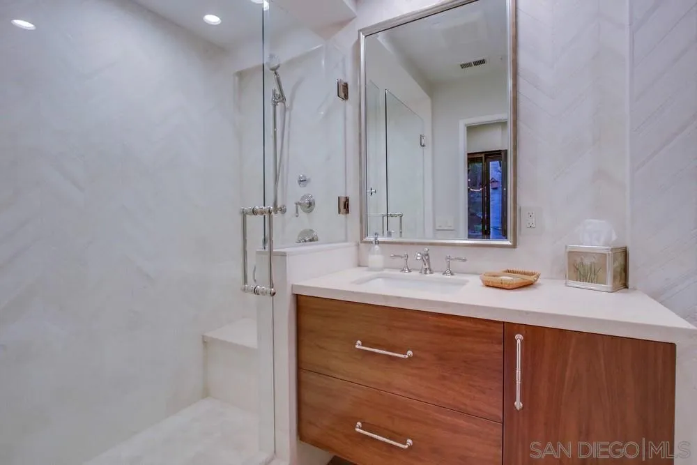 16062 Stoney Acres Road Poway, CA 92064 - Photo 49 of 75 a bathroom with a sink and a mirror
