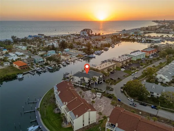 an aerial view of a house with a lake view