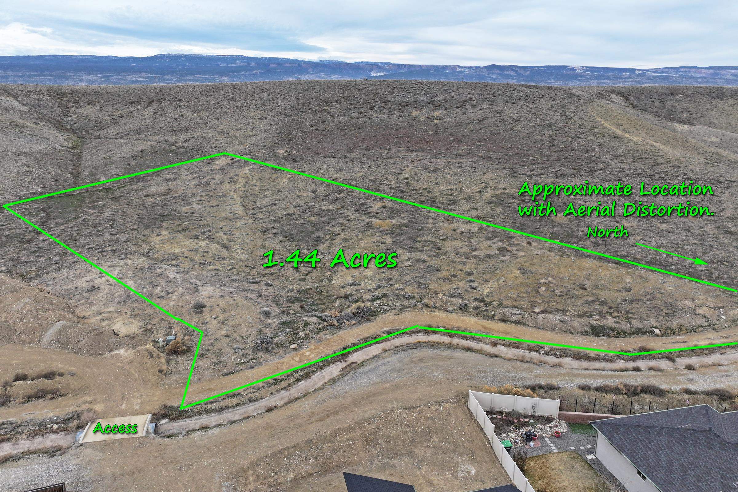 104 Dry Creek Road Grand Junction, CO 81503 - Photo 13 of 13 a small yard with wooden fence