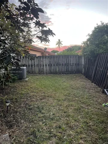 a view of a backyard of the house