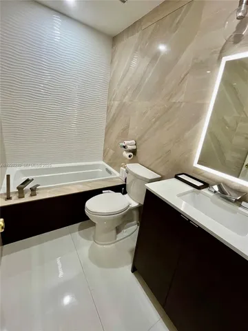 a bathroom with a sink a toilet and a bathtub