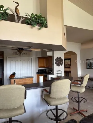 a kitchen with stainless steel appliances kitchen island granite countertop a stove and a sink